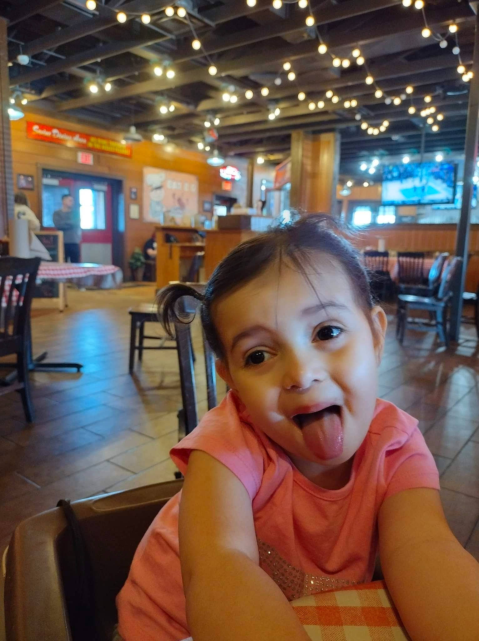 Angela joined the competition — help win amazing prizes! baby, chair, child, comfort_food, flooring, fun, happy, leisure, person, restaurant, room, sitting, skin, smile, table, tableware, toddler, tourism, travel, vacation