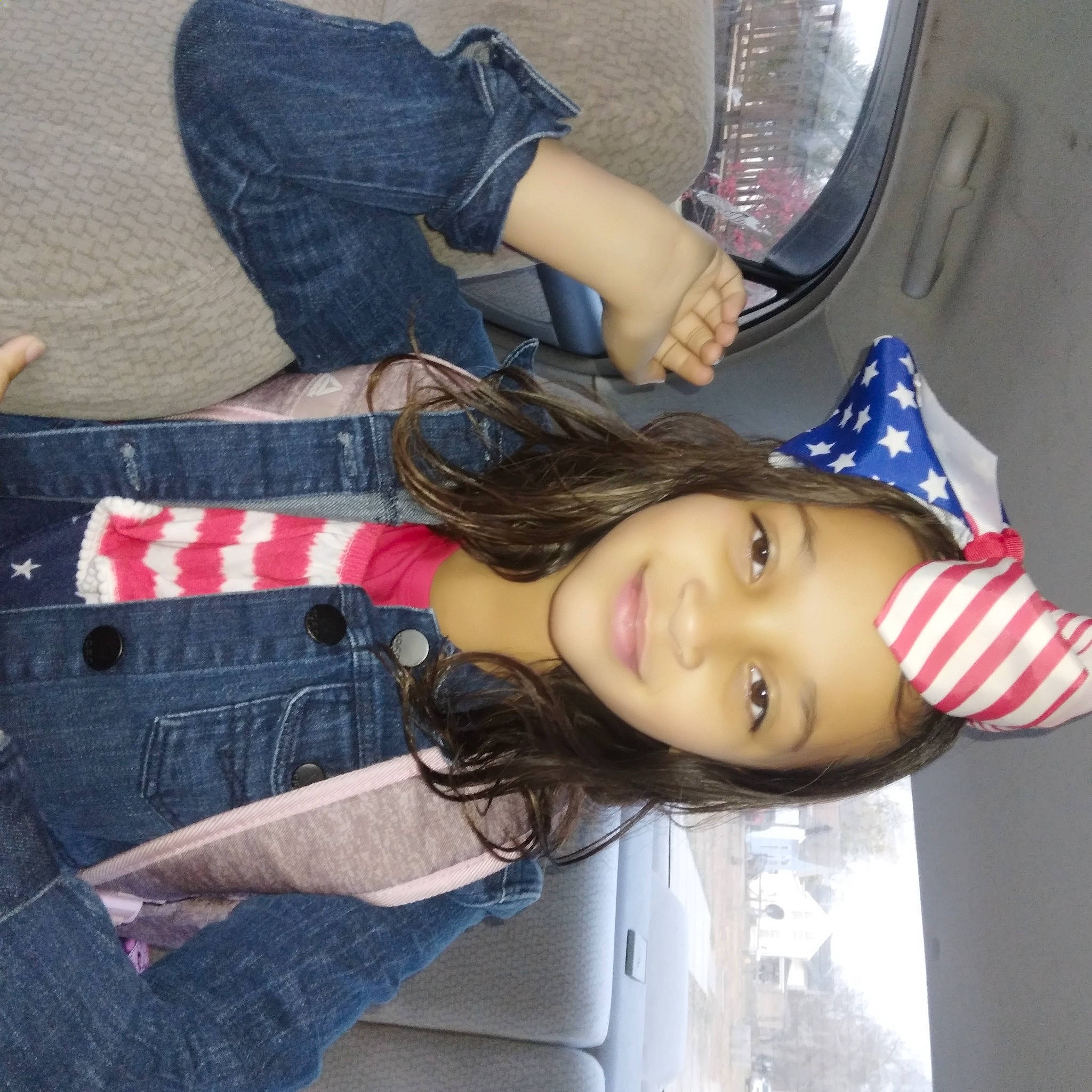 Kaylie is registered to the contest to win money with this photo: automotive_lighting, blond, clothing, denim, electric_blue, flag, flag_of_the_united_states, fun, human_leg, joy, lipstick, long_hair, person, smile, thigh, uniform, waist, white