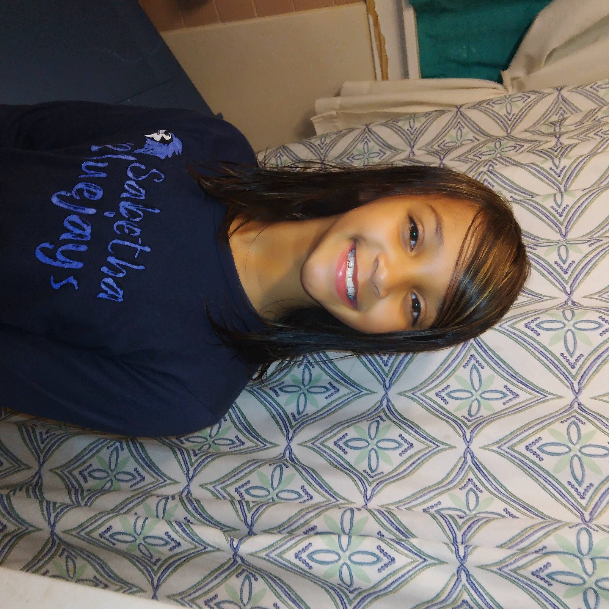 Kaylie joined the competition — help win amazing prizes! black_hair, child, comfort, cool, elbow, electric_blue, eyebrow, eyelash, flash_photography, flooring, fun, happy, human_leg, joy, linens, long_hair, mouth, person, room, skin