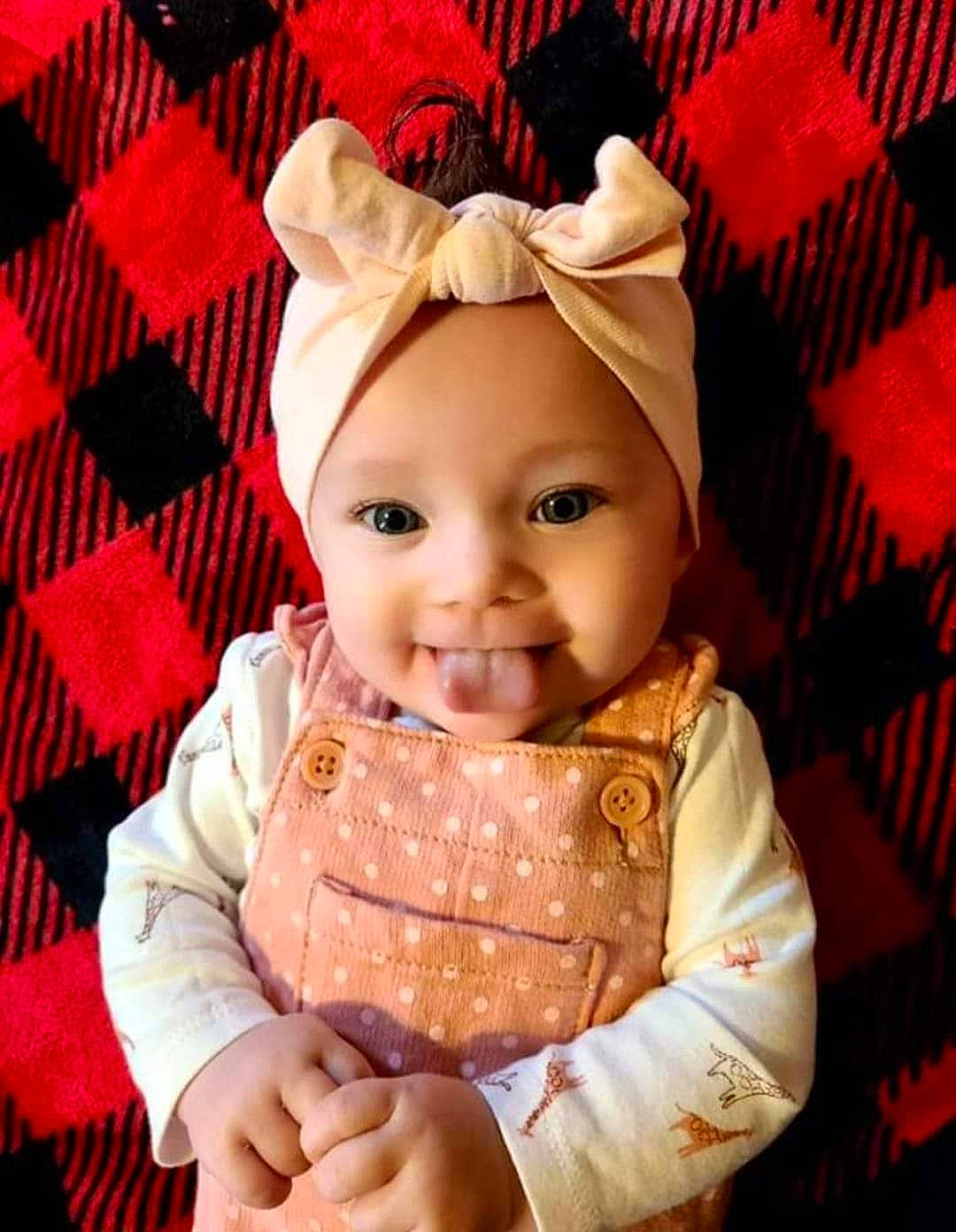 Rowyn is registered to the contest to win money with this photo: baby, baby_toddler_clothing, beauty, cap, child, costume_hat, design, eye, happy, head, headwear, human_body, magenta, pattern, peach, person, pink, red, sleeve, smile