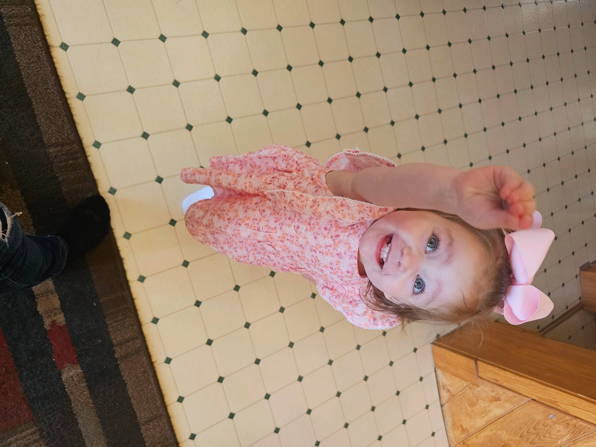 Rowyn is registered to the contest to win money with this photo: baby, baby_products, baby_toddler_clothing, bag, child, comfort, floor, flooring, happy, hardwood, joy, luggage_and_bags, magenta, pattern, person, pink, room, sleeve, smile, textile