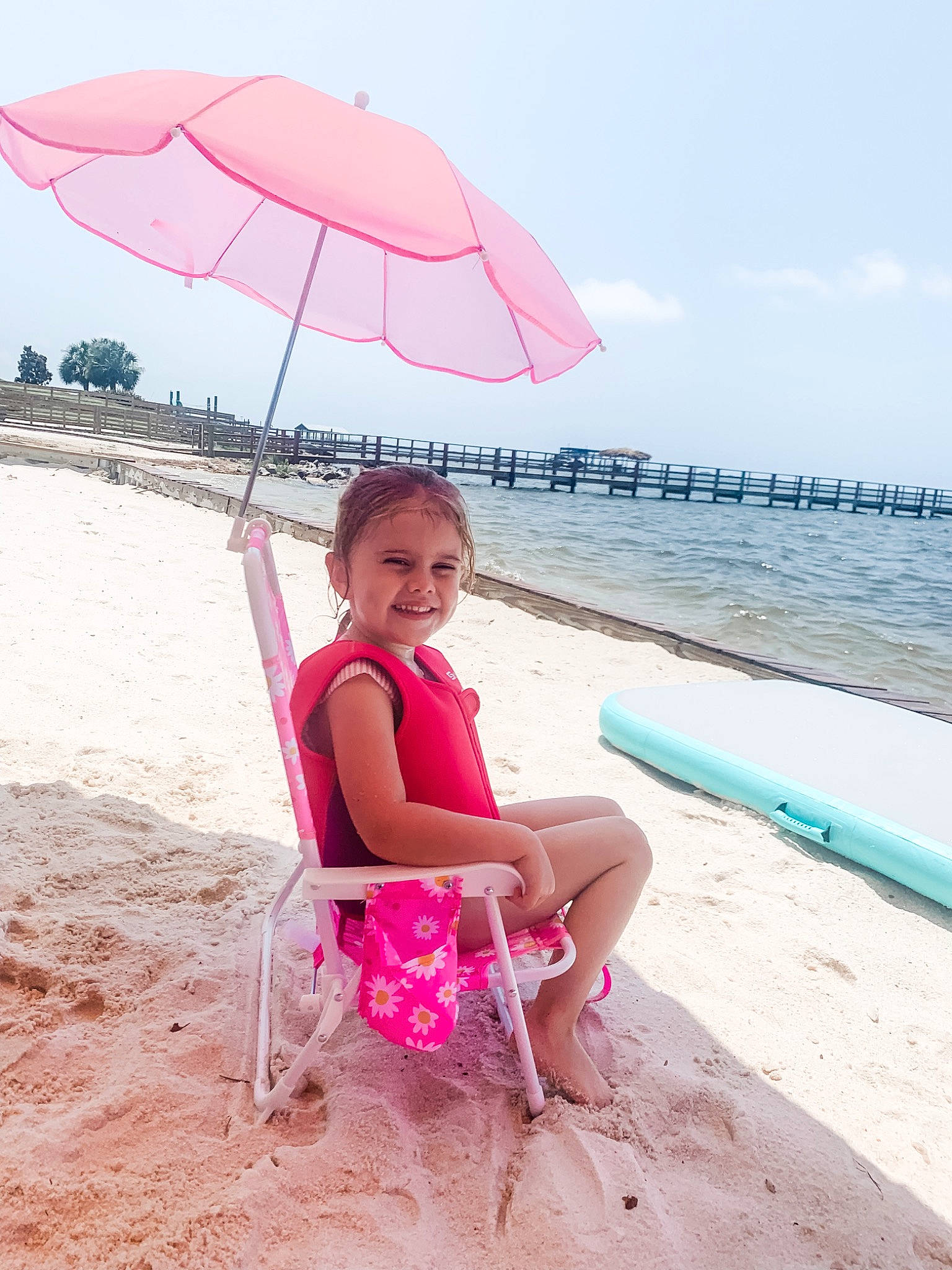 Winnie joined the competition — help win amazing prizes! beach, body_of_water, cloud, dress, fun, happy, joy, leg, leisure, morning, outdoor_furniture, people_in_nature, people_on_beach, person, pink, shade, sky, smile, summer, travel