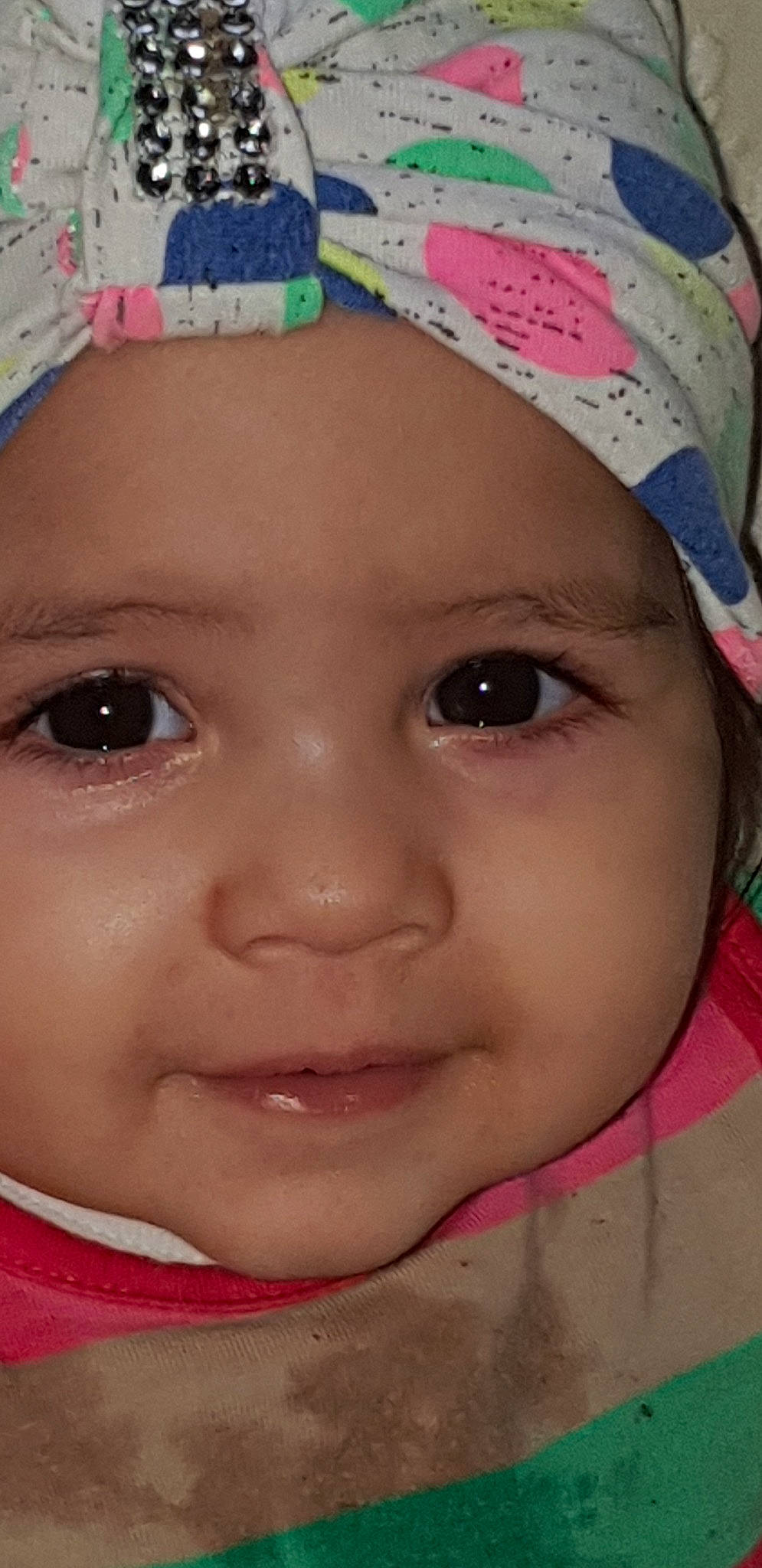 Mara is registered to the contest to win money with this photo: baby, cheek, child, chin, close_up, eye, eyebrow, eyelash, face, forehead, head, headgear, headwear, iris, lip, mouth, nose, person, pink, skin