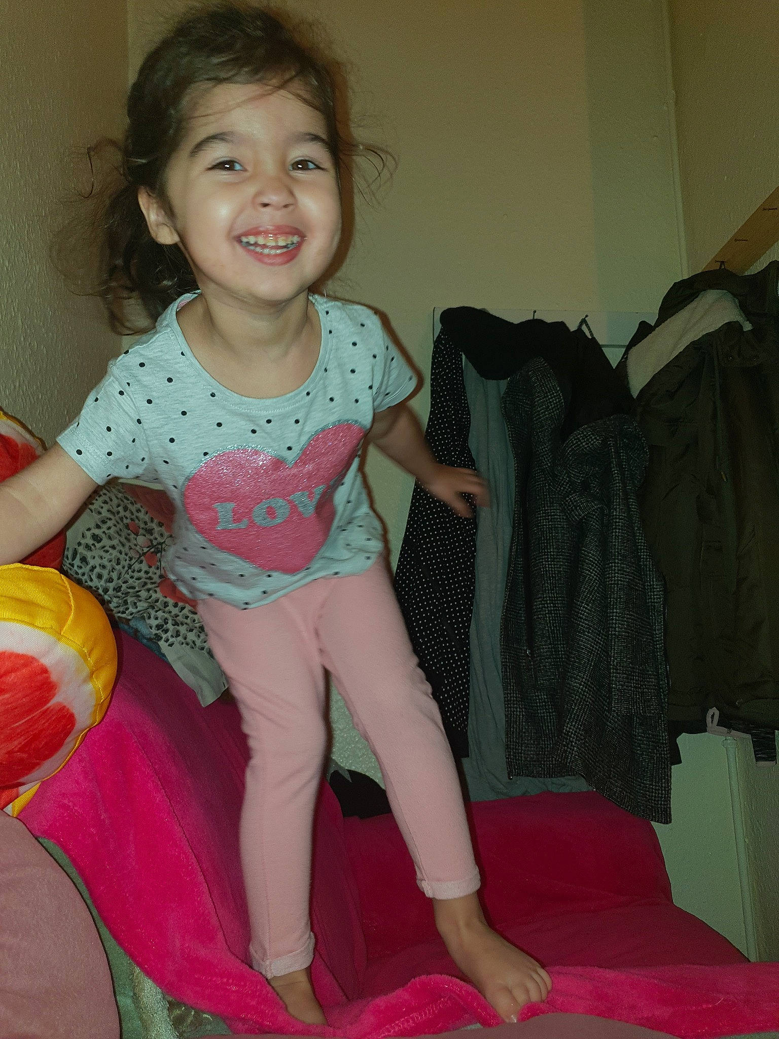 Maya is registered to the contest to win money with this photo: child, human_leg, joy, leg, person, pink, sitting, smile, thigh, toddler