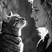 Tigrou participe au concours pour gagner de l'argent avec cette photo : black_and_white, cat, woman, portrait, profile, whiskers, curly_hair, collar, bell, intimate, gaze, soft_lighting, close_up, animal, pet, expression, side_view, feline, human, affection