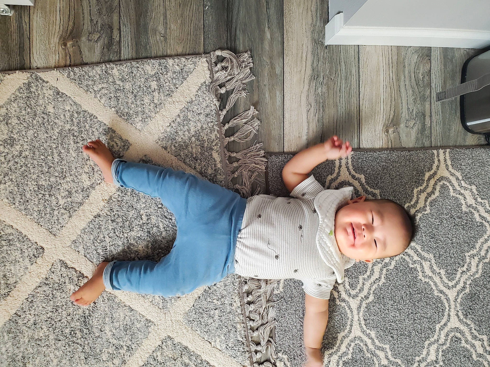 Hamilton joined the competition — help win amazing prizes! baby_toddler_clothing, child, comfort, concrete, floor, flooring, happy, human_body, human_leg, leisure, pattern, person, road_surface, sidewalk, sitting, smile, sunglasses, t_shirt, textile, toddler