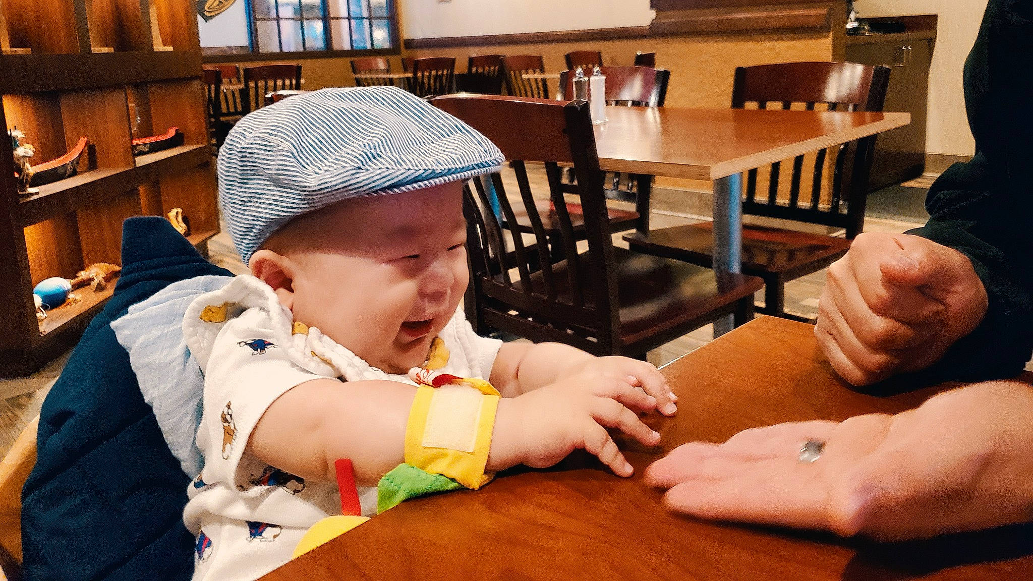 Hamilton joined the competition — help win amazing prizes! arm, bookcase, cap, chair, child, event, finger, fun, furniture, hand, hardwood, headwear, leisure, person, shelf, shelving, table, tableware, thumb, toddler