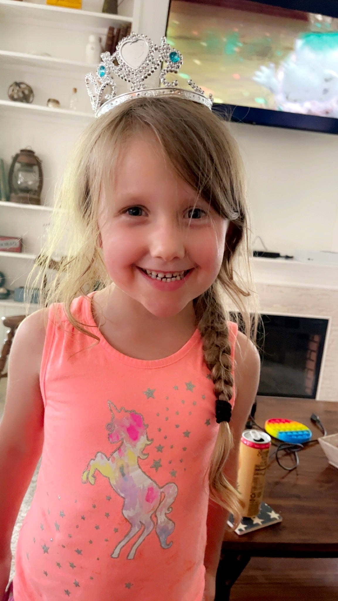 Kynzee is registered to the contest to win money with this photo: baby_toddler_clothing, blond, child, event, fashion_accessory, fun, hairstyle, happy, headpiece, joy, pattern, person, picture_frame, pink, play, shelf, shelving, sleeve, smile, standing