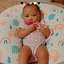 Isla is registered to the contest to win money with this photo: baby, child, cute, elephant, foot, hand, heart_filter, hedgehog, indoors, infant, legs, onesie, pacifier, pattern, pillow, pink, purple, rainbow, skin, sleeping_area