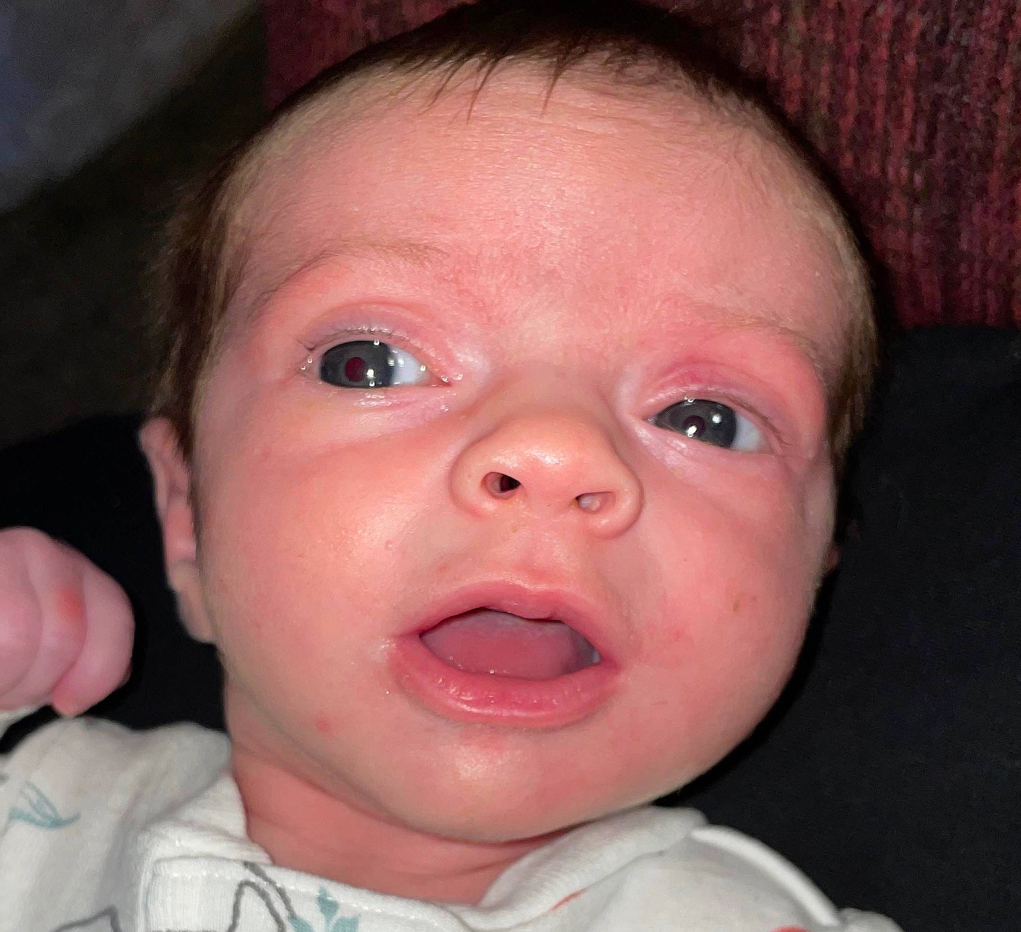 Ashley is registered to the contest to win money with this photo: baby, cheek, chin, ear, eyebrow, eyelash, facial_expression, finger, forehead, gesture, human_body, iris, jaw, lip, mouth, neck, nose, person, skin, toddler