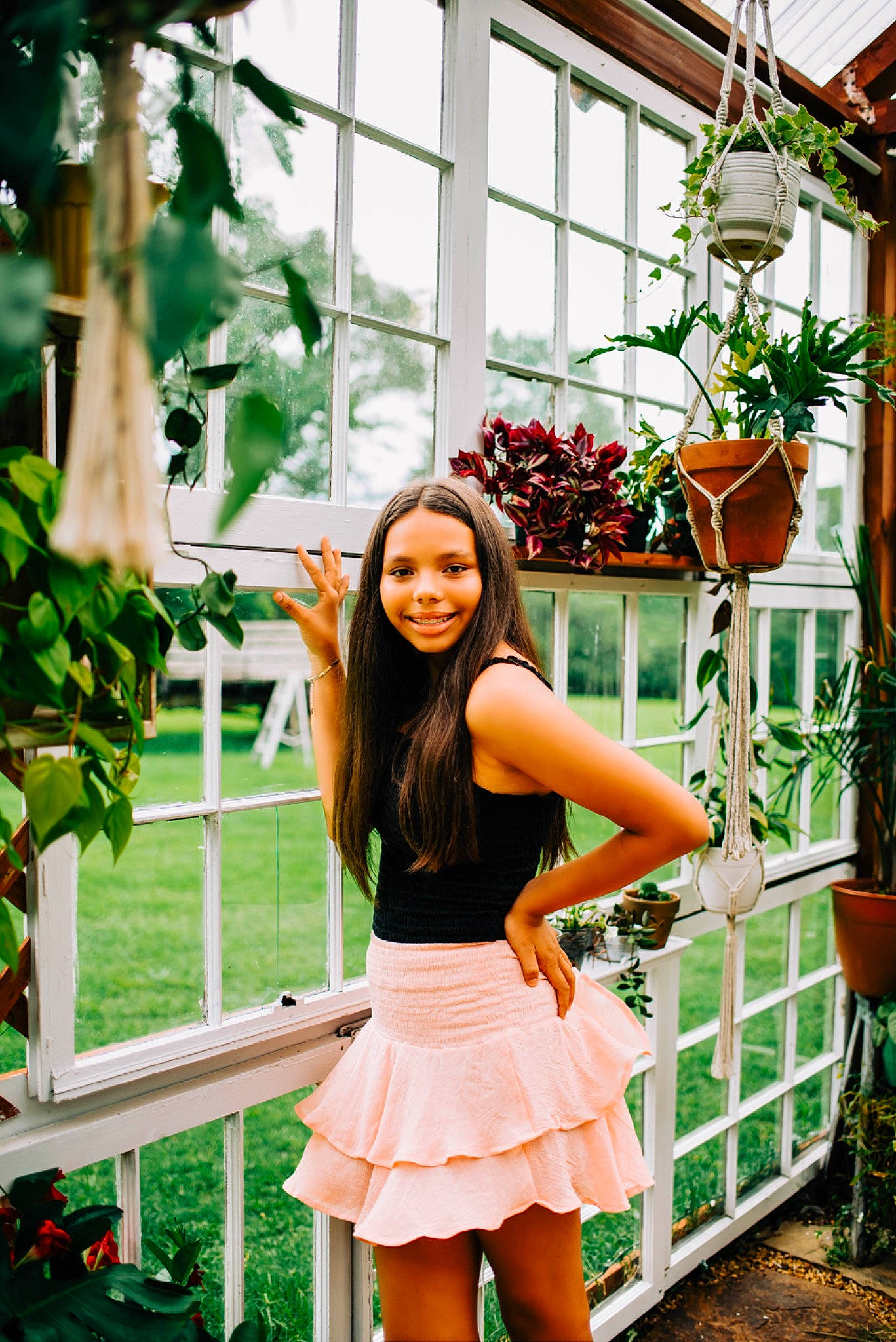 Erin is registered to the contest to win money with this photo: abdomen, electric_blue, event, grass, green, happy, houseplant, human_leg, joy, knee, leisure, long_hair, orange, person, plant, shorts, smile, thigh, tree, trunk