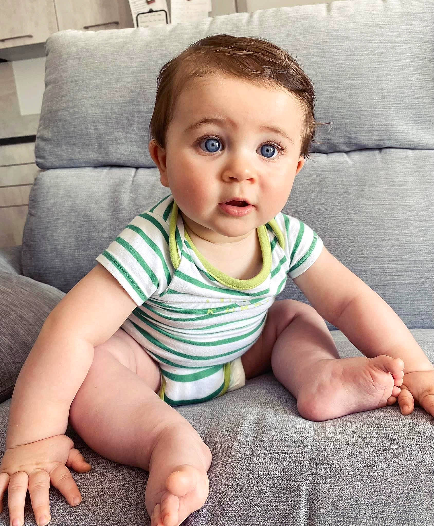 Charly participe au concours pour gagner de l'argent avec cette photo : baby, baby_toddler_clothing, cheek, child, chin, comfort, eye, finger, floor, flooring, hairstyle, head, iris, joint, person, sitting, skin, sleeve, smile, standing