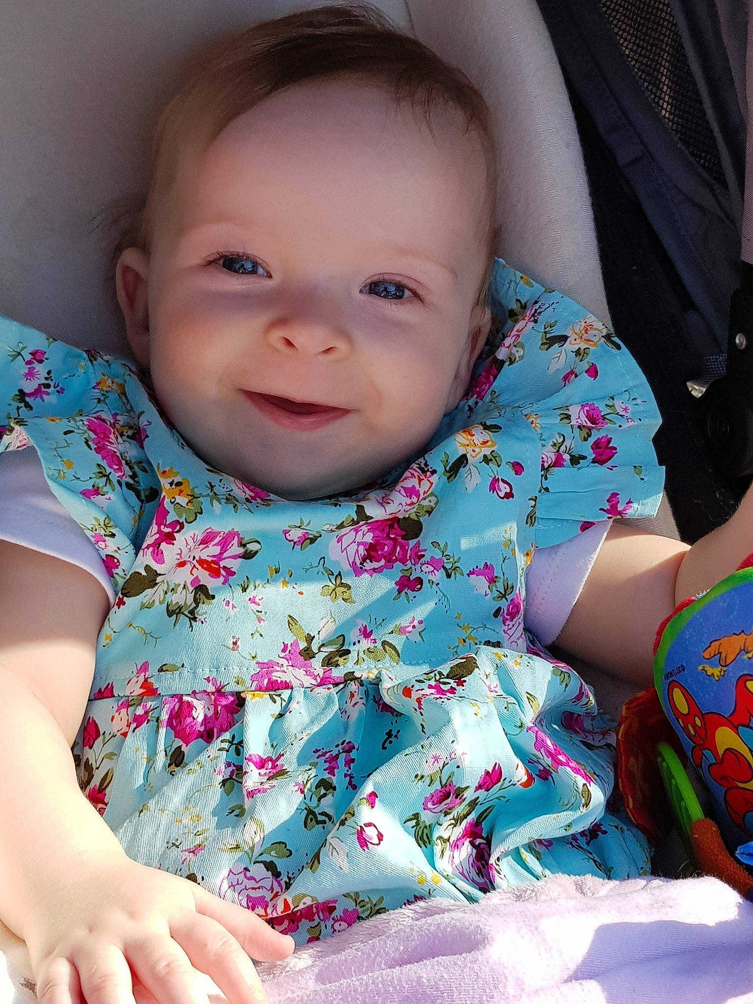 Michaela joined the competition — help win amazing prizes! baby, beauty, cheek, child, dress, eye, face, head, iris, lip, nose, person, pink, sitting, skin, smile, toddler