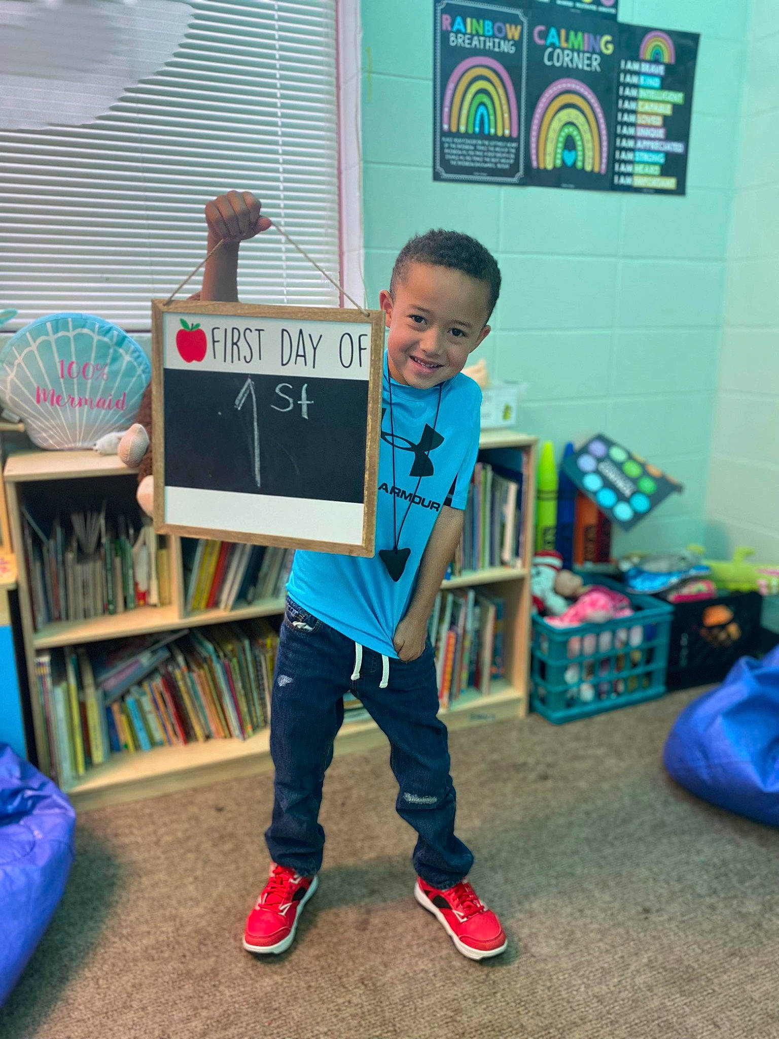 Kameron is registered to the contest to win money with this photo: blackboard, blue, bookcase, child, electric_blue, event, flooring, fun, happy, joy, leisure, luggage_and_bags, person, play, room, shelf, shoe, smile, sock, standing
