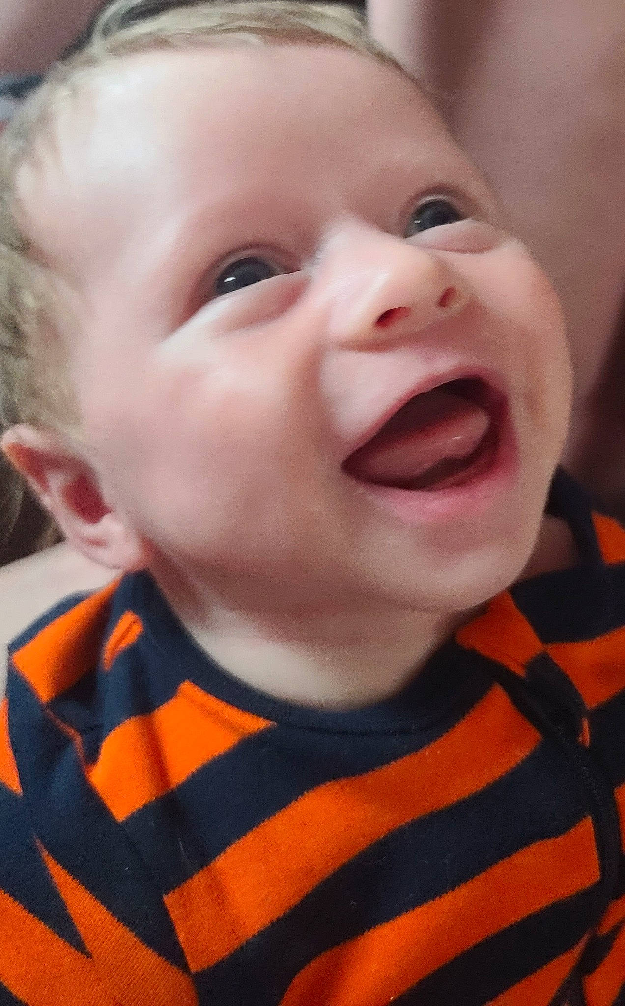 Chandler joined the competition — help win amazing prizes! baby, baby_laughing, cheek, chin, eye, eyebrow, fun, gesture, happy, head, iris, lip, mouth, nose, orange, person, skin, sleeve, smile, toddler