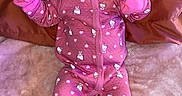 Kelani joined the competition — help win amazing prizes! baby, infant, pink, pajamas, headband, pacifier, blanket, lying_down, cute, mittens, sleepwear, soft_texture, indoors, portrait, child, smiling_eyes, clothing, cozy, baby_girl, resting