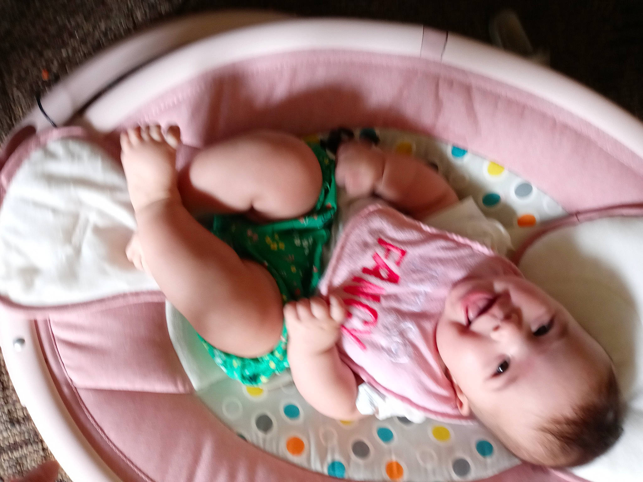 Claudia is registered to the contest to win money with this photo: baby, baby_products, baby_toddler_clothing, child, comfort, dishware, dress, foot, human_leg, leg, linens, mouth, nail, pattern, person, pink, skin, sweetness, tableware, textile