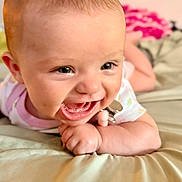 Elena joined the competition — help win amazing prizes! baby, cheerful, child, closeup, clothing, cute, expression, face, hand, happy, head, indoors, infant, lying_down, person, pink, skin, smiling, soft_surface, toy