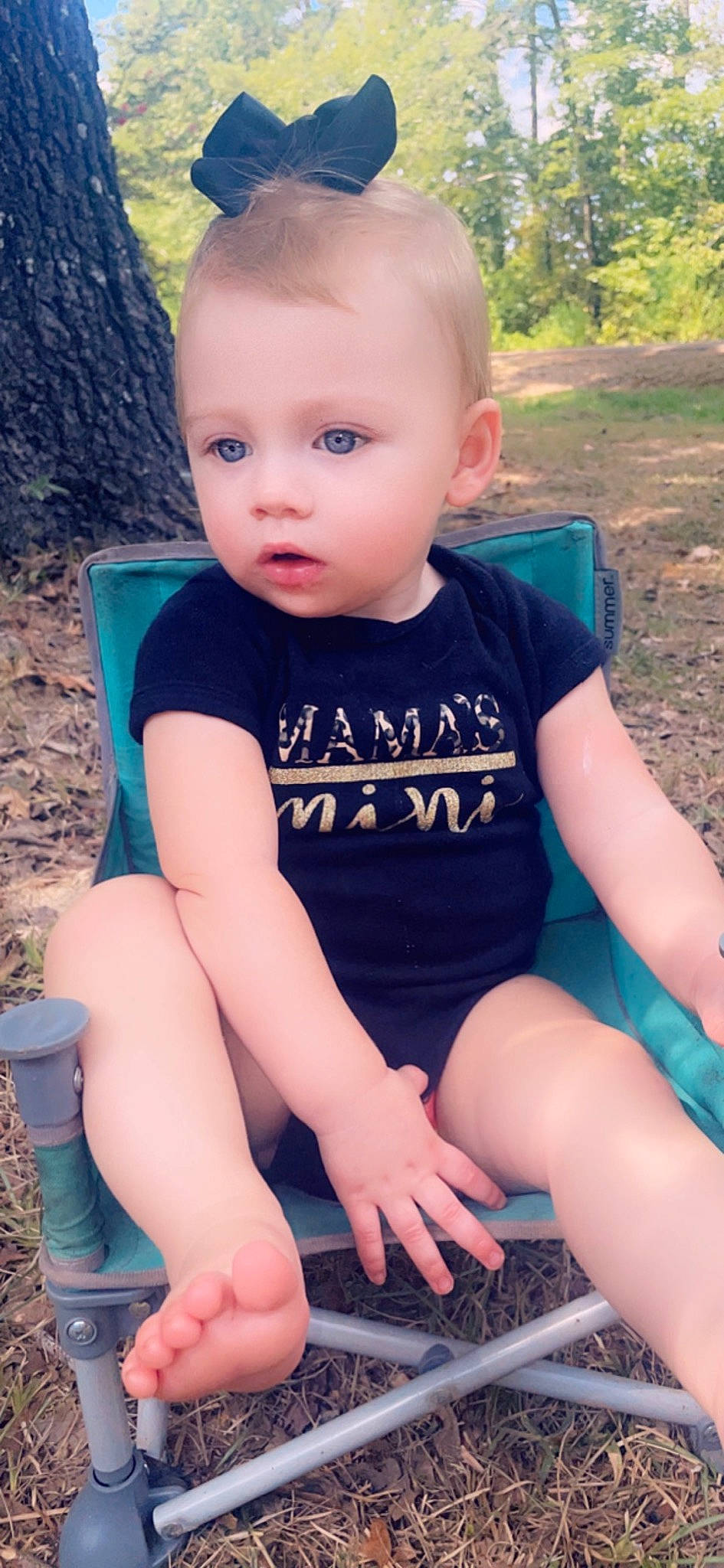 Kimberlyn is registered to the contest to win money with this photo: arm, azure, baby_toddler_clothing, black, blue, eye, face, facial_expression, hairstyle, happy, head, joint, muscle, neck, organ, person, photograph, plant, skin, standing