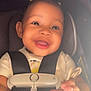Naylani is registered to the contest to win money with this photo: baby, car_seat, child, clothing, cute, expressive, face, hand, happy, indoors, infant, joy, person, portrait, safety, seat, seatbelt, smiling, straps, young_child