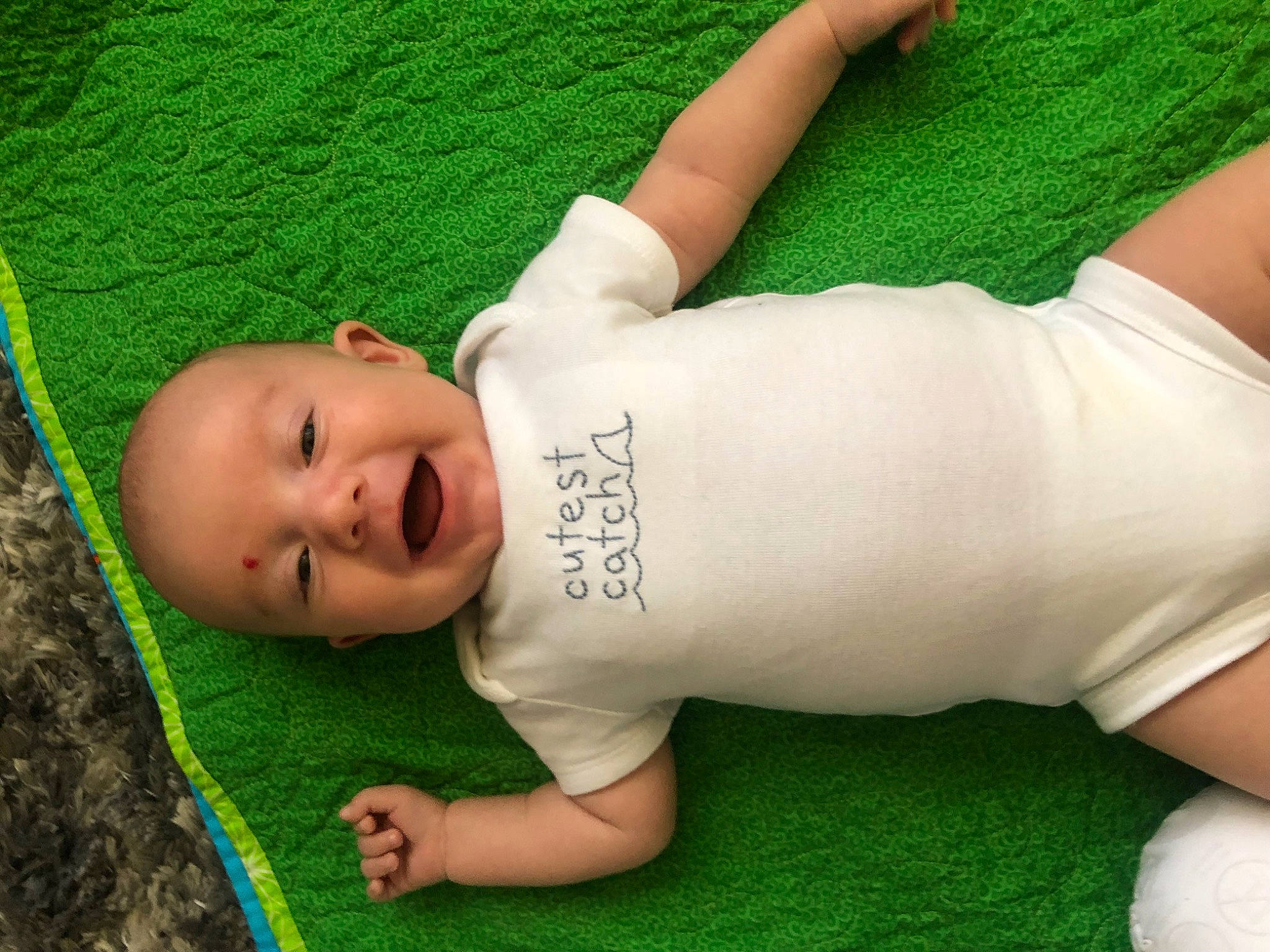 Kase is registered to the contest to win money with this photo: arm, elbow, eye, facial_expression, flooring, grass, green, hand, human_body, joint, knee, lawn, leg, leisure, neck, person, skin, textile, thigh, waist