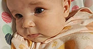 Novalea joined the competition — help win amazing prizes! baby, infant, face, closeup, blanket, soft_fabric, child, cute, portrait, expression, indoors, resting, head, eyes, skin, clothing, colorful, pattern, polka_dots, young