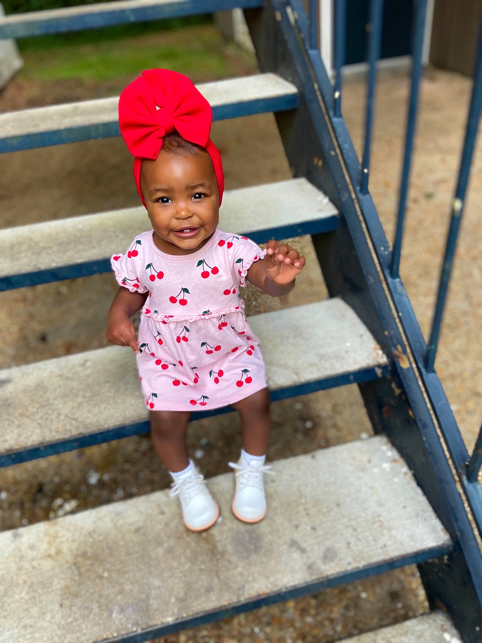 Denver is registered to the contest to win money with this photo: baby, baby_toddler_clothing, child, child_model, face, head, headgear, joy, people, person, pink, plant, play, playground, public_space, red, shoe, skin, smile, toddler