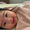 Rhylee joined the competition — help win amazing prizes! baby, infant, smiling, closeup, face, pink_blanket, heart_pattern, cute, child, sleeping_area, portrait, soft_toys, happy, indoors, cozy, young, skin, expression, head, person