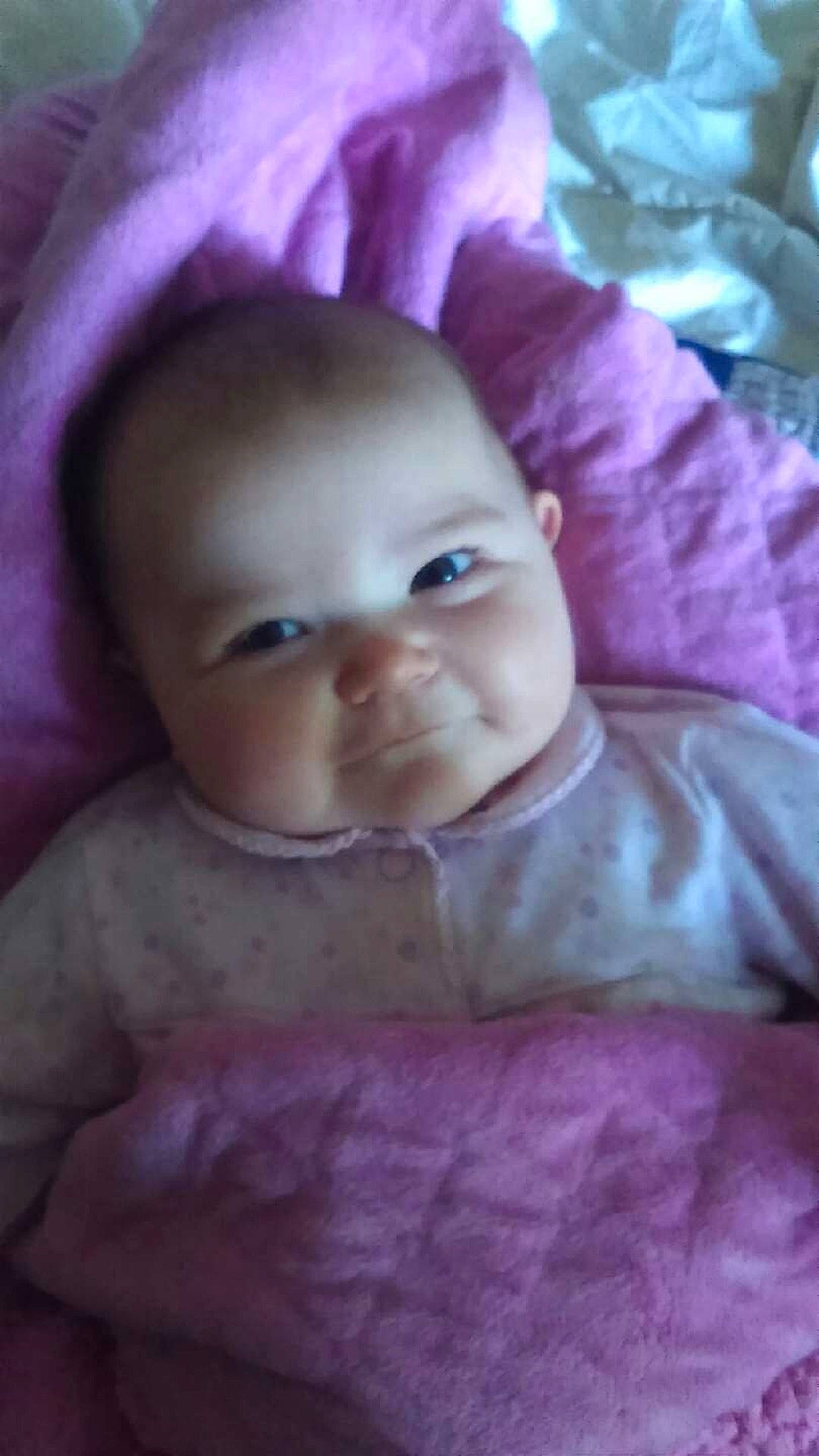 Annabelle is registered to the contest to win money with this photo: cheek, child, close_up, ear, eye, face, forehead, girl, head, infant, iris, lip, mouth, nose, person, pink, purple, skin, toddler