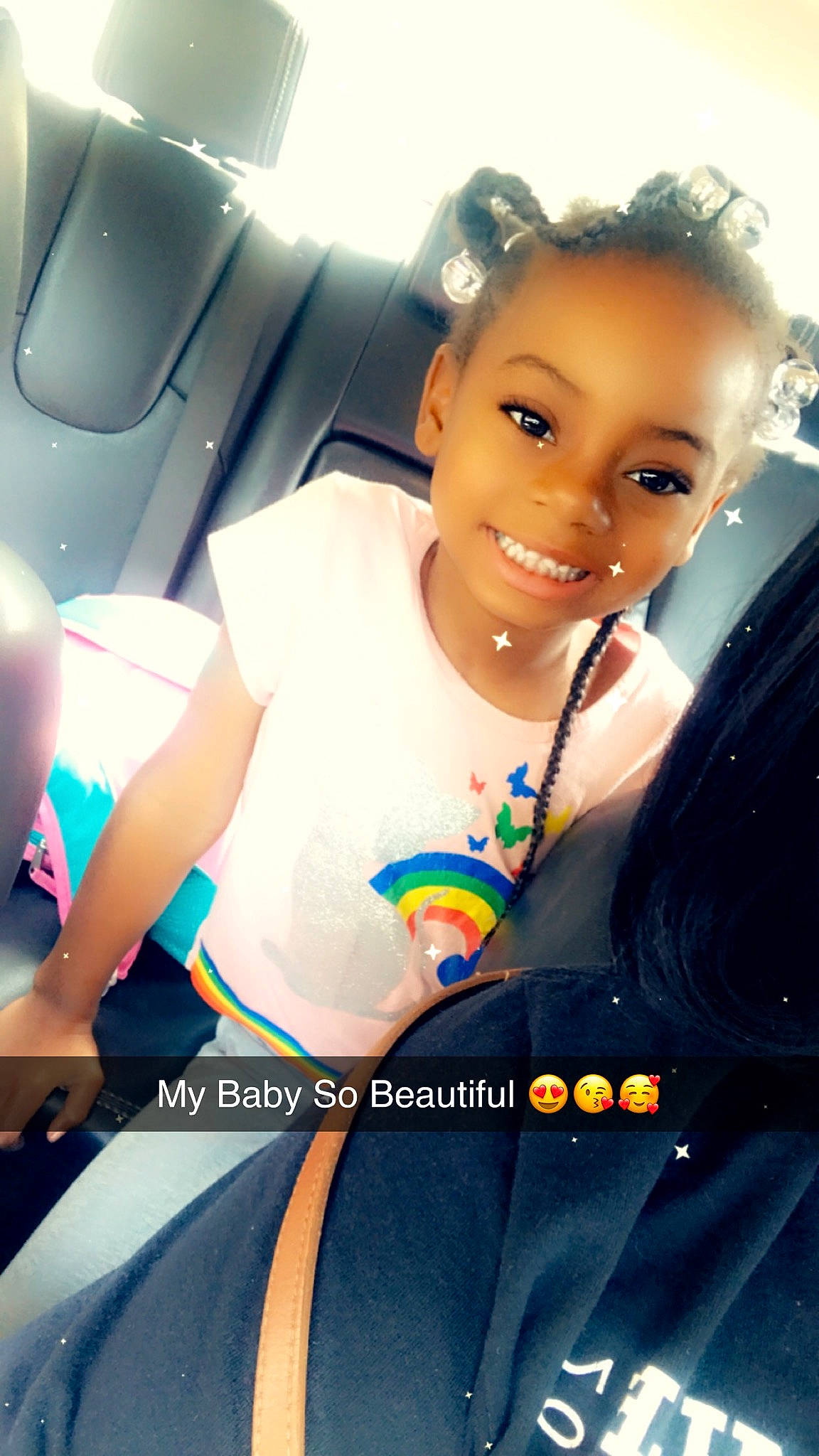 Avianna is registered to the contest to win money with this photo: auto_part, black_hair, car_seat, child, child_model, cool, family_car, fashion_design, finger, gesture, hair, hairstyle, happy, joy, long_hair, person, photography, seat_belt, sitting, smile