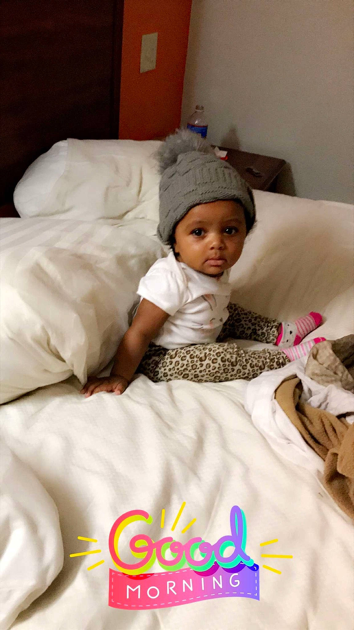 Kimani is registered to the contest to win money with this photo: baby, bed, bed_sheet, bedding, bedtime, child, comfort, furniture, happy, headgear, headwear, linens, person, skin, sleep, smile, textile, toddler