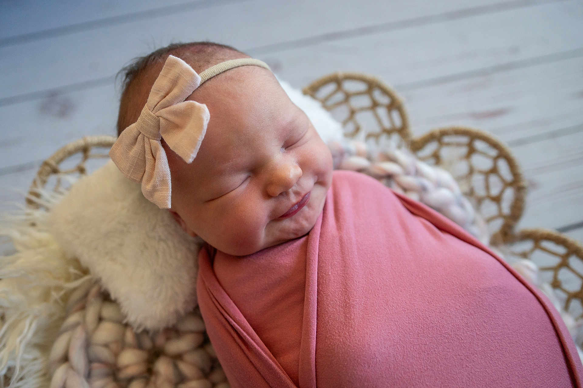 Everly joined the competition — help win amazing prizes! baby, bow, child, closeup, cozy, cute, headband, indoors, infant, knitted_cushion, newborn, peaceful, pink_blanket, portrait, resting, sleeping, smiling, soft_texture, woven_backdrop, wrapped