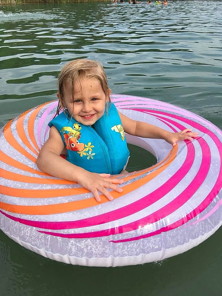 Emmie is registered to the contest to win money with this photo: baby_float, child, fun, games, inflatable, joy, leisure, person, pink, play, product, recreation, summer, toddler, tubing, vacation, vehicle