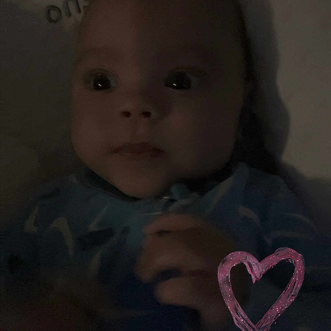 Masiah joined the competition — help win amazing prizes! baby, blanket, child, closeup, clothing, cute, dark, expression, face, hand, heart_doodle, indoor, infant, love, low_light, newborn, person, portrait, sleeping_area, young