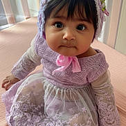 Maëlys joined the competition — help win amazing prizes! baby, child, infant, dress, lace, bonnet, pink, purple, sitting, cute, portrait, indoors, soft_light, face, hands, feet, curious, young, person, adorable