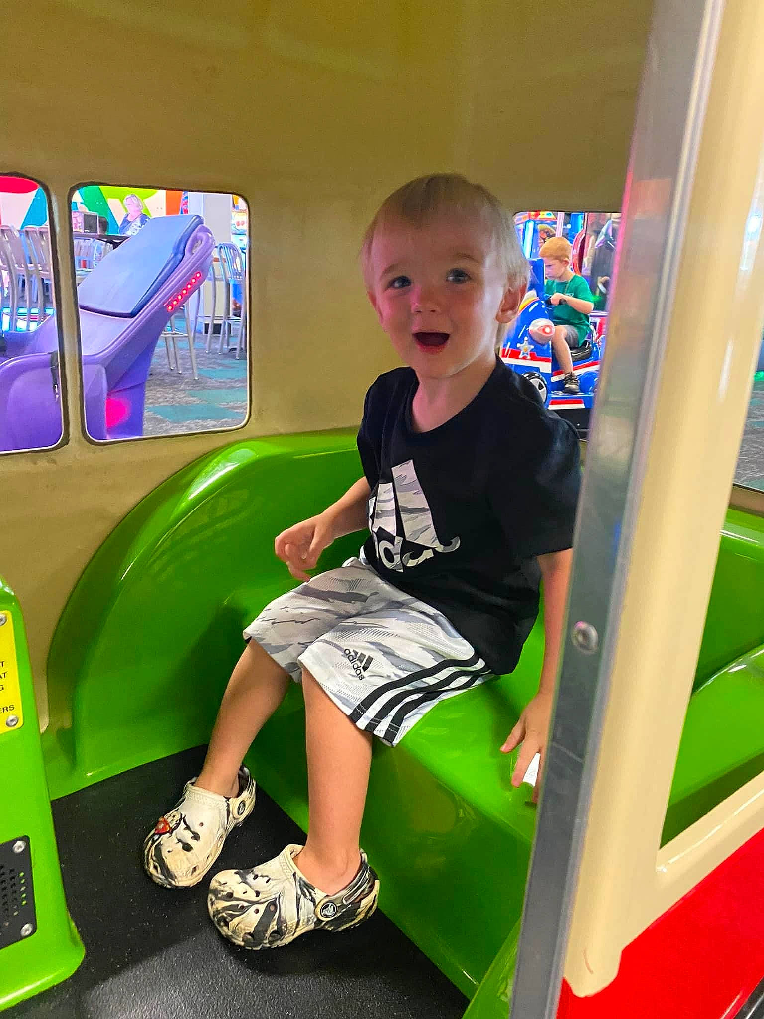 Wyatt is registered to the contest to win money with this photo: baby_playing_with_toys, child, fun, games, learning, leisure, machine, person, play, recreation, room, sandal, shorts, sitting, smile, standing, t_shirt, toddler, toy_vehicle, yellow
