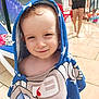 Aloïs participe au concours pour gagner de l'argent avec cette photo : background, blue, child, face, family, hair, happy, outdoor, people, person, poolside, relaxation, smile, stars, summer, sunny, swimwear, toddler, towel, water