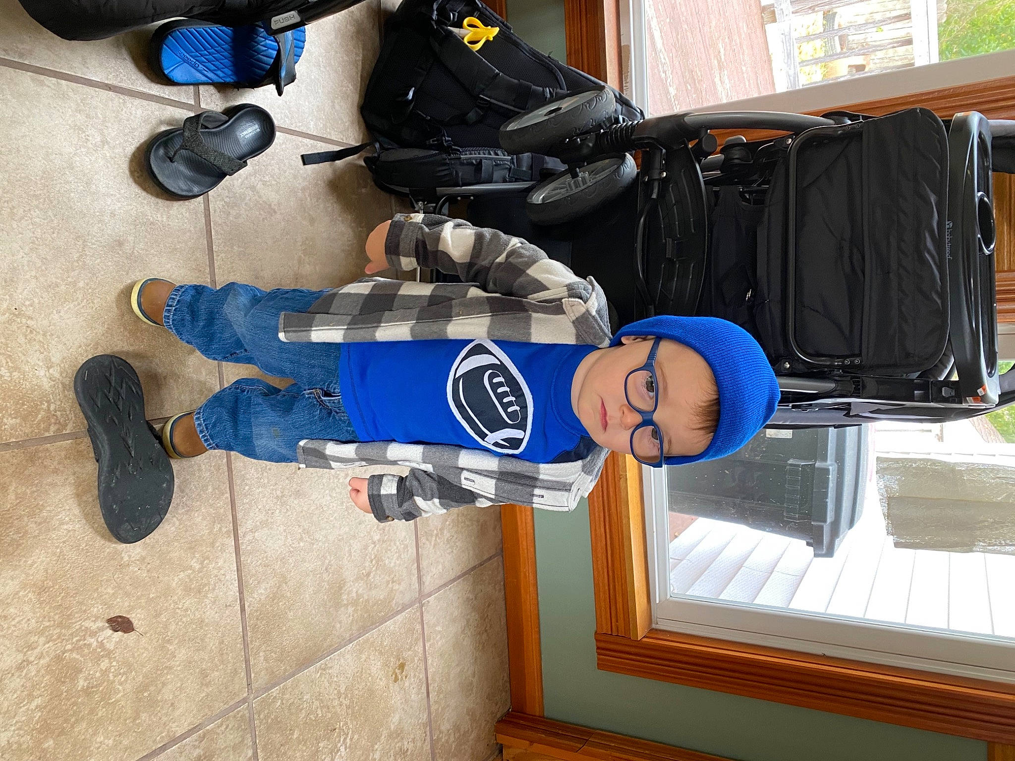 Theodore is registered to the contest to win money with this photo: athletic_shoe, denim, elbow, electric_blue, foot, human_leg, knee, leg, machine, outdoor_shoe, person, personal_protective_equipment, shoe, sports_gear, sportswear, walking_shoe, window