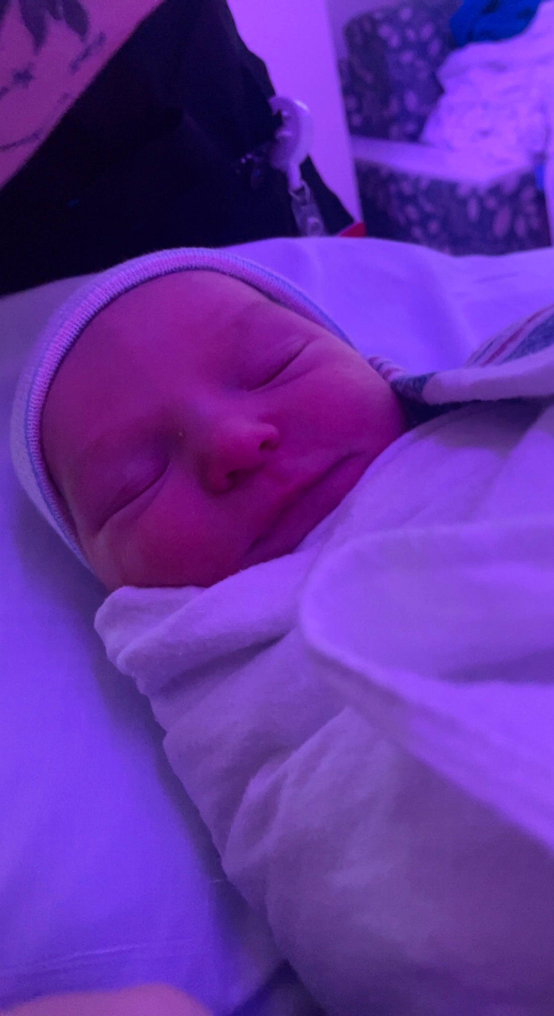 Bradley is registered to the contest to win money with this photo: baby, bedtime, carmine, cheek, child, comfort, darkness, electric_blue, event, fun, linens, magenta, nap, person, petal, pink, purple, room, sleep, toddler