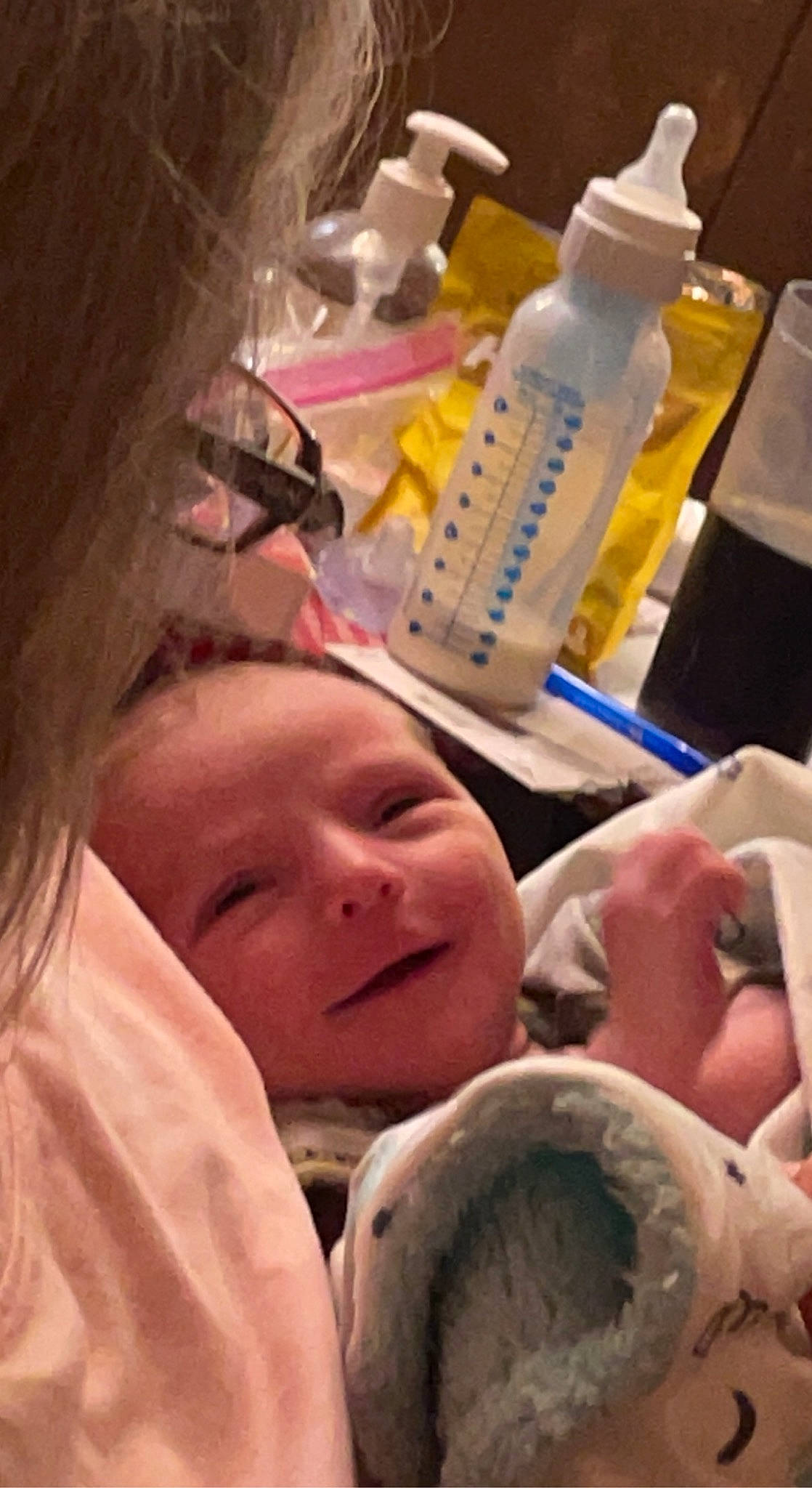 Bradley is registered to the contest to win money with this photo: baby, bottle, cheek, child, comfort, fun, happy, health_care, medical, mouth, nose, person, plastic, plastic_bottle, room, science, service, skin, smile, thumb