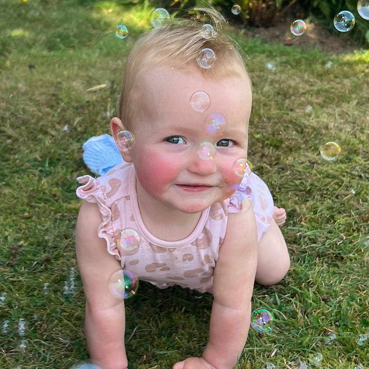 Bree joined the competition — help win amazing prizes! baby, bubbles, cheeks, child, crawling, curly_hair, daylight, face, grass, greenery, happy, infant, nature, outdoor, person, play, skin, smiling, summer, sunlight