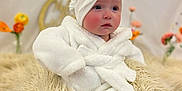 Bree is registered to the contest to win money with this photo: baby, blanket, child, curious, cute, decor, flower, fluffy, fuzzy, indoor, infant, portrait, robe, rosy_cheeks, sitting, soft, towel, turban, warm, wrapped