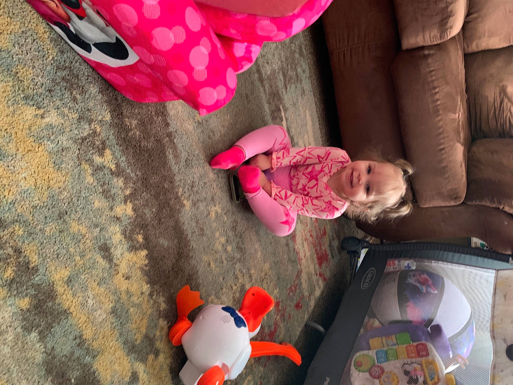 Melodi joined the competition — help win amazing prizes! baby, baby_toddler_clothing, child, comfort, couch, finger, floor, flooring, fun, human_body, human_leg, joy, leg, leisure, magenta, people, person, pink, red, textile