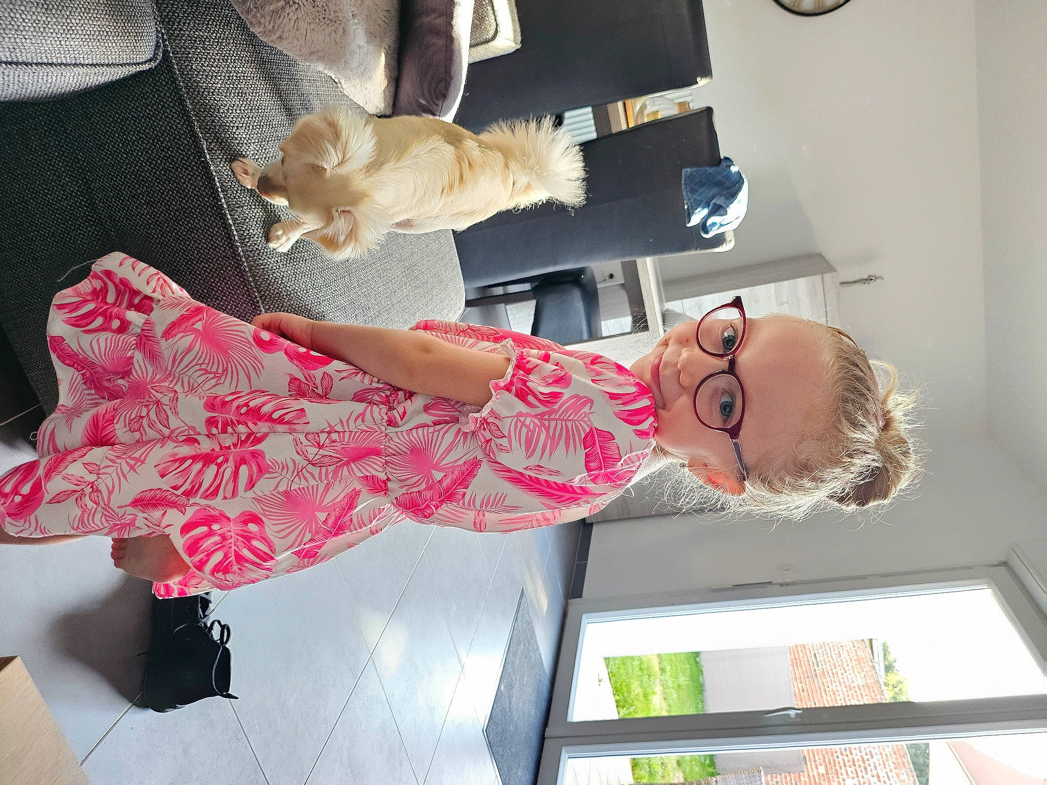 Ilyana participe au concours pour gagner de l'argent avec cette photo : carmine, child, dress, eyewear, fashion_design, fur, human_leg, lap, magenta, pattern, person, pink, room, sleeve, smile, thigh, tire, toy, wheel
