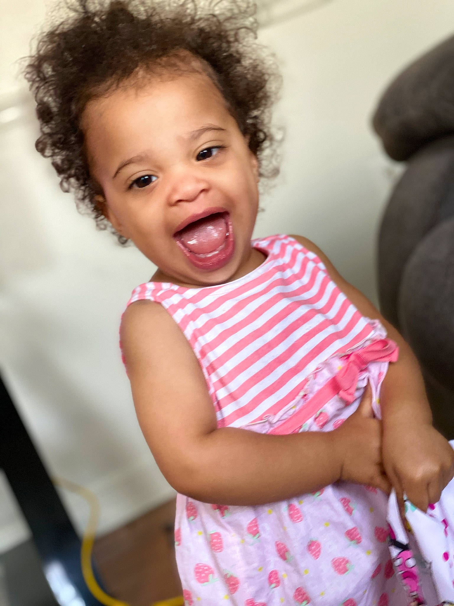 Mariyah is registered to the contest to win money with this photo: baby, beauty, cheek, child, eye, face, facial_expression, fun, hair, happy, head, lip, nose, person, pink, play, sitting, skin, smile, toddler