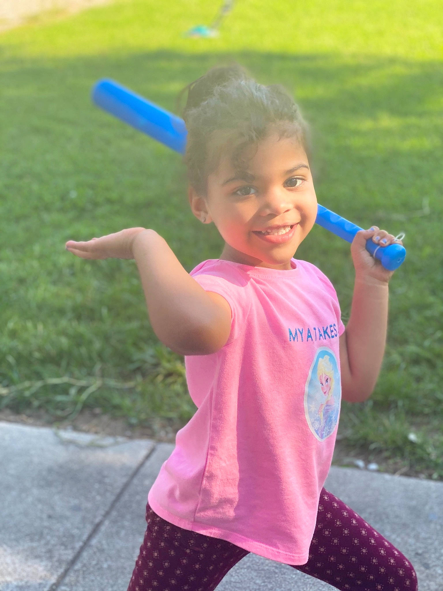 Mya is registered to the contest to win money with this photo: arm, child, fun, grass, happy, joy, leisure, person, pink, play, playground, public_space, recreation, smile, summer, toddler, vacation, water