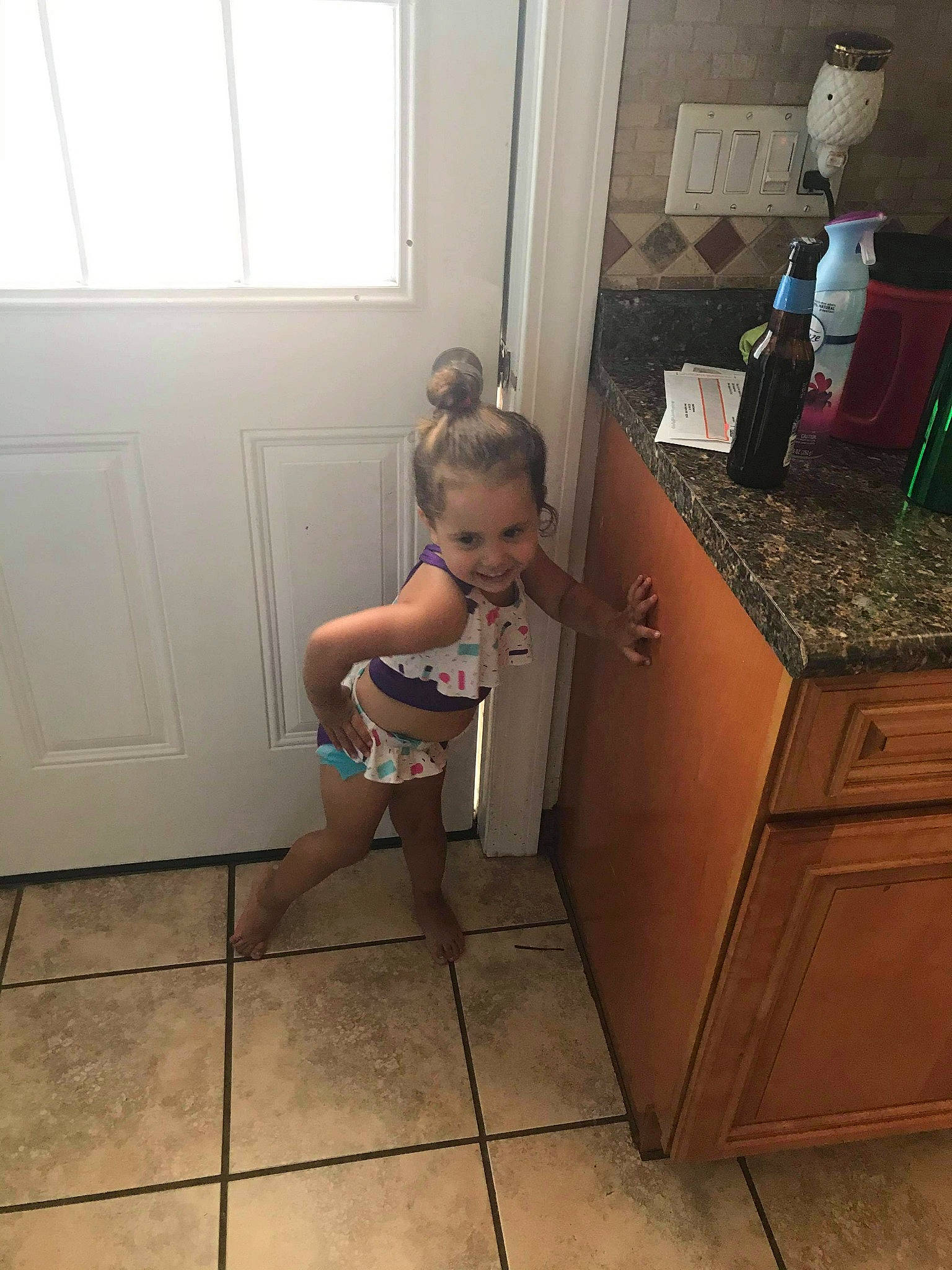 Celeste is registered to the contest to win money with this photo: child, drawer, floor, flooring, furniture, joy, leg, person, room, tile, toddler