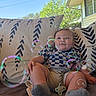 baby, child, bubbles, outdoor, cushion, patterned_cushion, blue_sky, trees, sunlight, smiling, shorts, socks, pacifier, relaxed, happy, infant, summer, portrait, casual, cute
