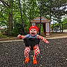 Waylen joined the competition — help win amazing prizes! baby, child, swing, playground, outdoor, trees, greenery, red_beanie, checkerboard_outfit, happy, smiling, playhouse, seat, fun, nature, park, falling_leaves, infant, casual_clothing, daylight