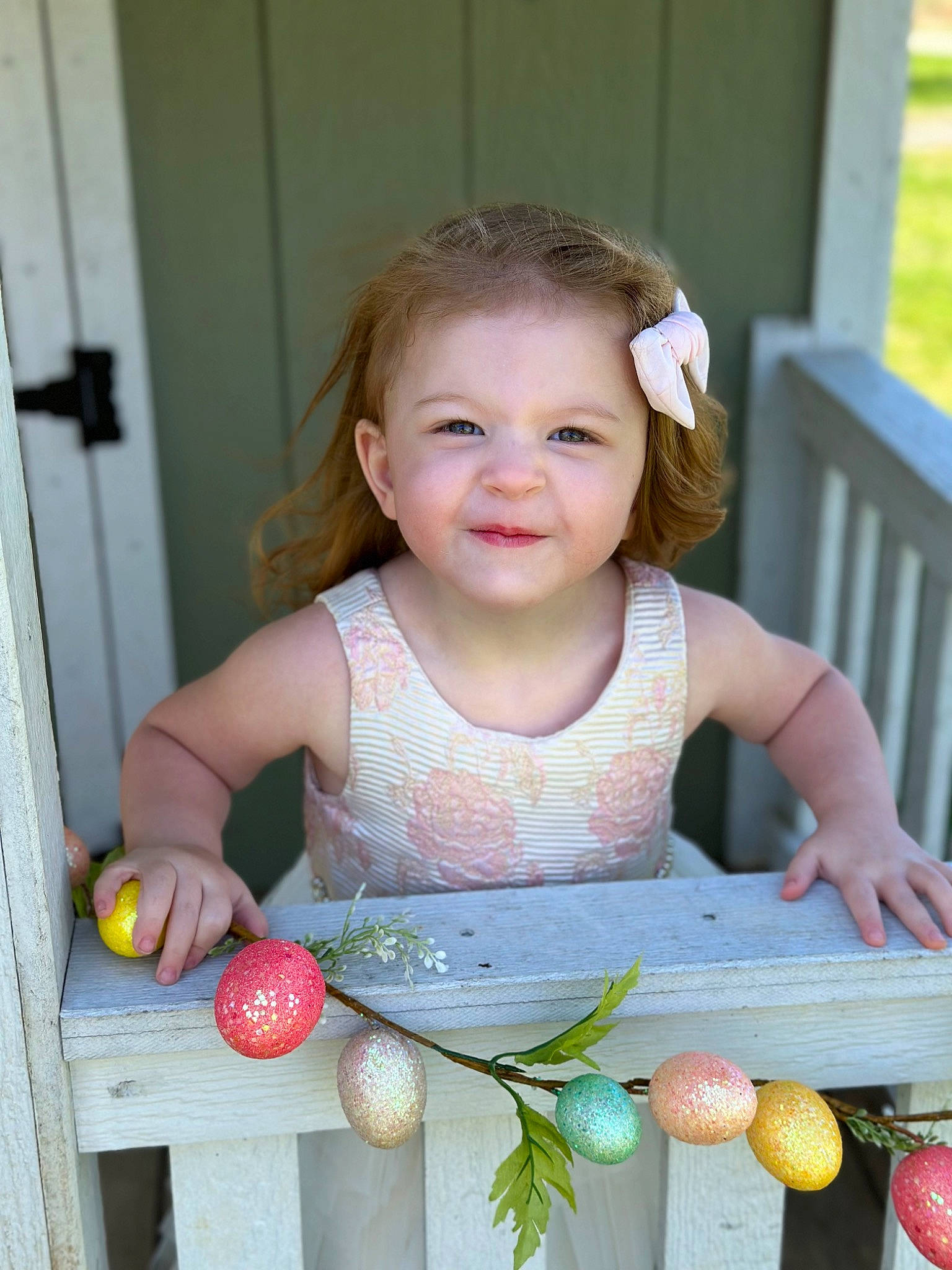 Aniya joined the competition — help win amazing prizes! baby, baby_toddler_clothing, child, dress, facial_expression, finger, fruit, grass, hand, happy, natural_foods, people, person, plant, skin, smile, standing, summer, tableware, toddler